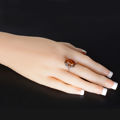 amber and silver ring on hand