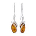 Genuine Baltic honey amber drop earrings “Gemma” in 925 sterling silver with oval amber stones and fish hook dangle design on white background
