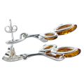 Side view of Alicia Baltic honey amber earrings in 925 sterling silver, showing post back closure and open-back marquise amber cabochon settings.