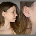Model wearing Elena genuine Baltic honey amber earrings in 925 sterling silver, lightweight post back dangle design shown from side profile and close-up view on ear