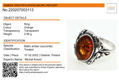 Sterling silver ring with oval Baltic honey amber stone in an ornate vintage-style setting