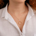 real amber pendant on model Balticana Jewelry