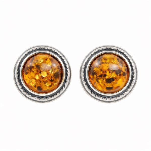 Pair of genuine Baltic honey amber stud earrings in oxidized 925 sterling silver, round cabochon amber stones with natural inclusions on white background