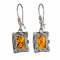 Genuine Baltic honey amber rectangular drop earrings in 925 sterling silver with French hook ear wires, natural amber inclusions visible