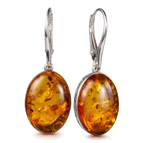 Pair of oval Baltic honey amber earrings in 925 sterling silver with French leverback closures, featuring natural amber inclusions and handcrafted open-back cabochon design